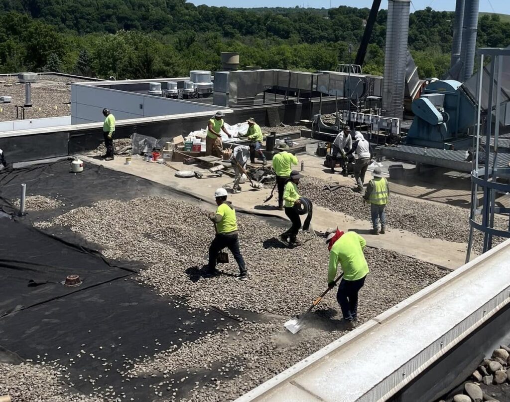 Weathertite Solutions working on a roof